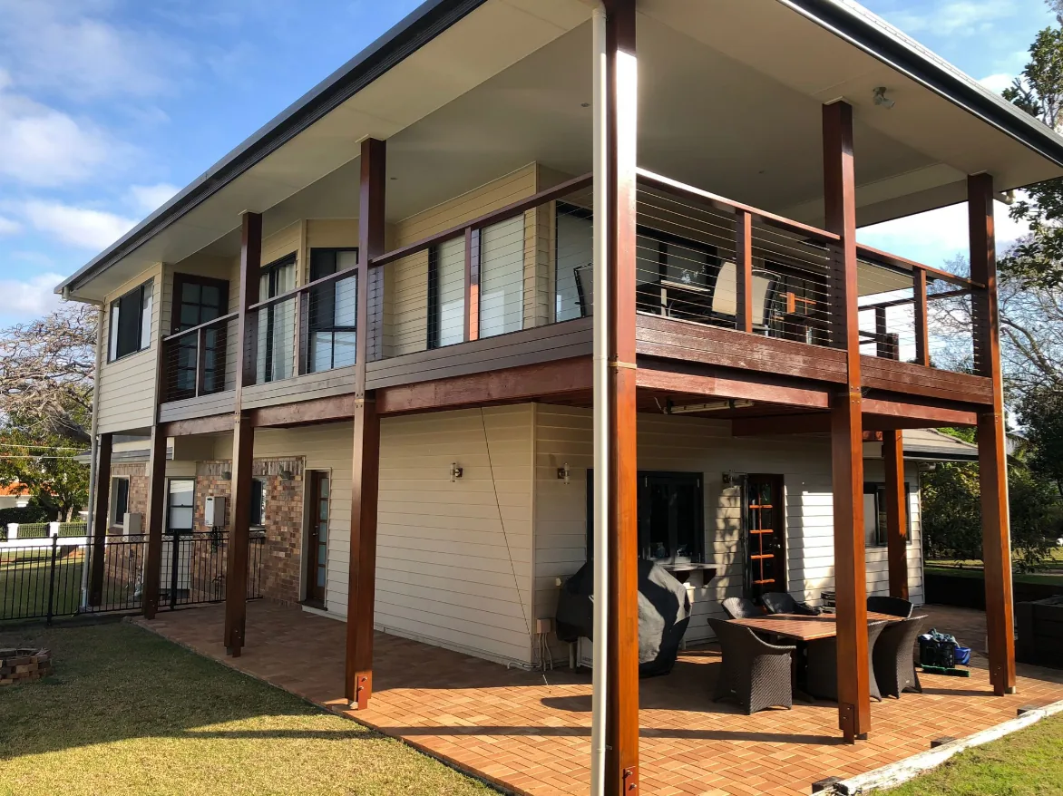 A two-storey Brisbane Queenslander with its windows cleaned
